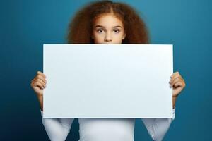 AI generated Cute little girl holding blank white sheet of paper in her hands photo