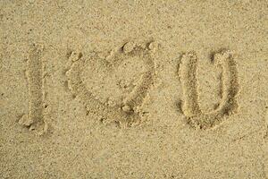 I love you text on sand photo