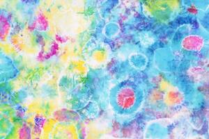 colorful tie dye pattern hand dyed on cotton fabric abstract texture background. photo