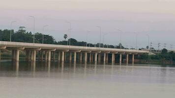 expressway bridge designed by construction and civil engineers for travel and transportation with modern technology in construction is a simple construction on a lake in Thailand. video