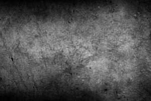 Dark grey or black concrete wall textured background photo