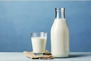 AI generated A bottle of milk and a glass of milk on a wooden table on a blue background. AI Generated photo