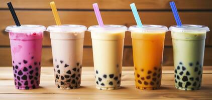 AI generated Plastic cups of different tasty bubble tea on wooden background. Generative AI photo