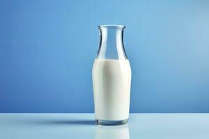AI generated A glass bottle with full milk on blue background. AI Generated photo