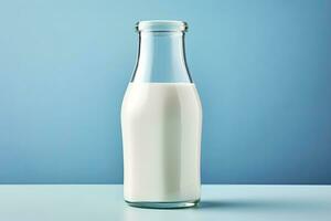 AI generated A glass bottle with full milk on blue background. AI Generated photo