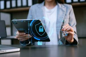 Cybersecurity and privacy concepts to protect data. Lock icon and network security technology. Man protecting personal data on smartphone tablet, virtual screen interfaces. photo