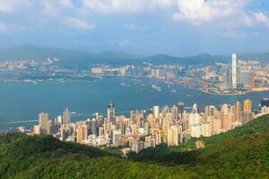 view of victoria harbour and hong kong island over high west peak in hongkong, china photo