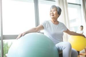 AI generated Senior Asian woman doing exercise with a swiss ball at a gym photo