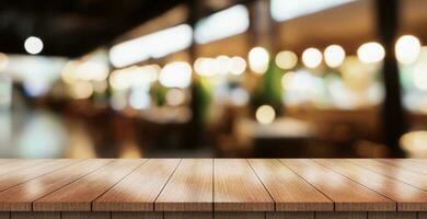 Empty wooden table top with lights bokeh on blur restaurant background. photo