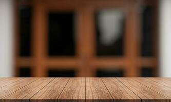 Empty wooden table top with lights bokeh on blur restaurant background. photo