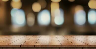 Empty wooden table top with lights bokeh on blur restaurant background. photo