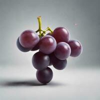 AI generated A single, translucent purple grape rests on a dark gray slate countertop. photo