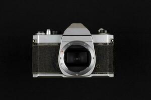 Vintage Film Camera isolated on black background photo