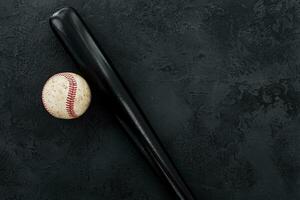 closeup of baseball bat and ball photo