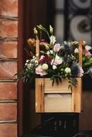 fresh  flowers in wooden pot photo