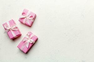 Valentine day composition red  gift box with bow and heart. Christmas present. View from above. Space for text. Holday greeting card photo