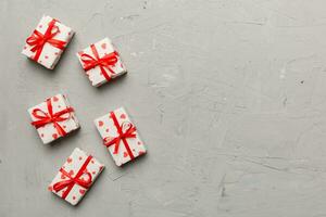 Valentine day composition red  gift box with bow and heart. Christmas present. View from above. Space for text. Holday greeting card photo