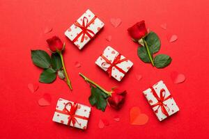 Kraft Gift box with beautiful red ribbon and rose, concept of Valentine day, anniversary, mother day and birthday greeting, copy space, top view photo