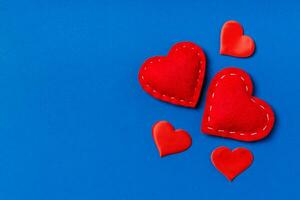 Top view composition of red hearts on colorful background. Romantic relationship concept. Valentaine's Day photo