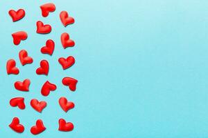 Valentine day background with red hearts, top view with copy space photo