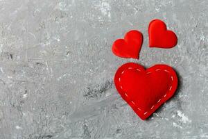 Top view of red hearts on cement background with copy space. Romantic concept. Valentine's day concept photo