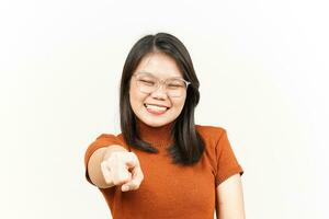 Smiling and Pointing at You, Want You Gesture Of Beautiful Asian Woman Isolated On White Background photo