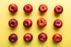 Many red apples on colored background, top view. Autumn pattern with fresh apple above view photo