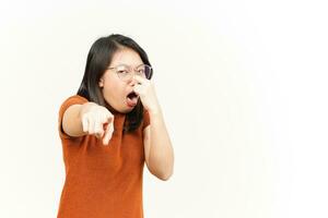 Smelling something stinky and disgusting Of Beautiful Asian Woman Isolated On White Background photo