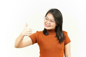 Showing Thumbs Up Of Beautiful Asian Woman Isolated On White Background photo