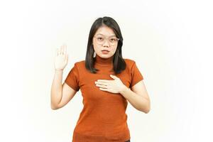 Swearing or Promise Gesture Of Beautiful Asian Woman Isolated On White Background photo