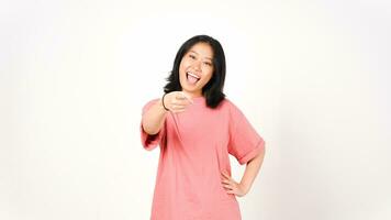 Young Asian woman in pink t-shirt smiling and pointing to the camera on isolated white background photo