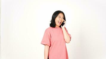 Young Asian woman talking on the phone isolated on a white background. photo