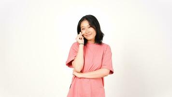 Young Asian woman in pink t-shirt showing korean love finger on isolated white background photo