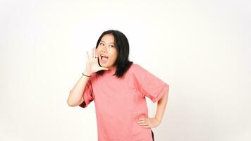 Young asian woman shouting and announcing something isolated on white background. photo