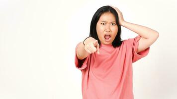 Young Asian woman in pink t-shirt pointing at camera and shout isolated on white background photo