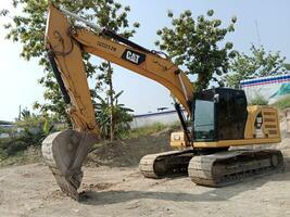Demak, December 24 2023. excavator in construction project. heavy vehicle sign and symbol. photo