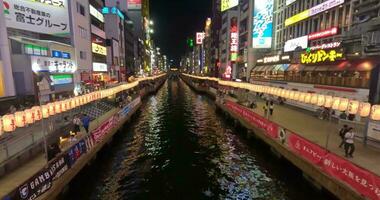 Osaka at night. Canal view. Shops and restaurants colorful signs video