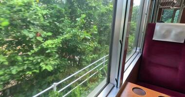 The oldest train in Japan is going up the mountains, Hakone town window view video