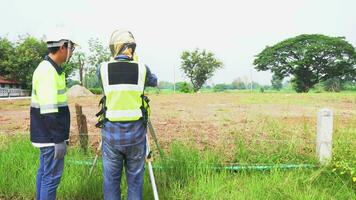 Asia surveyor telescope engineering surveying construction site. video