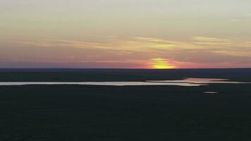 Aerial view of beautiful emerald green water lake and summer landscape sunset. Sunset on the lake photo