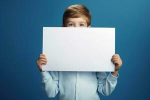 AI generated Little boy holding a blank white sheet of paper photo