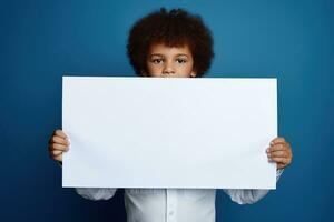 AI generated Little boy holding a blank white sheet of paper photo