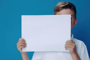 AI generated Little boy holding a blank white sheet of paper photo