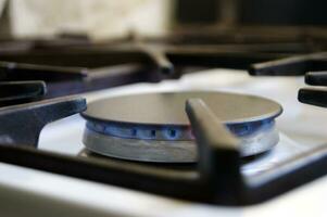 Kitchen gas stove with low burning propane gas. photo