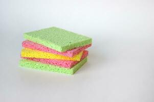 Bright colored sponges for washing dishes, cleaning the bathroom and other household needs. photo