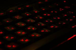 Backlit gaming keyboard close up. photo