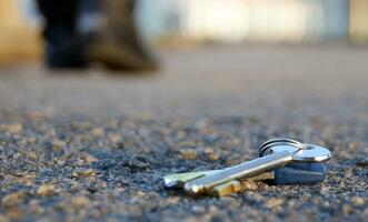 A man lose keys on the road. photo