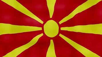 Norden Mazedonien Flagge winken Stoff perfekt Schleife, voll Bildschirm Animation 4k Auflösung. video