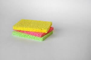 Bright colored sponges for washing dishes, cleaning the bathroom and other household needs. photo