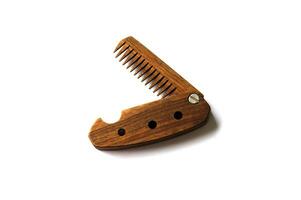 Male wooden comb for beard and hair isolated on a white background. photo